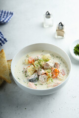 Traditional fish soup with vegetables and cream