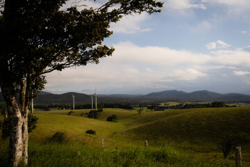 Lush Hilly view over a Valley With clouds rolling over