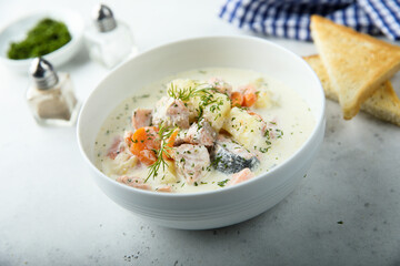 Traditional fish soup with vegetables and cream
