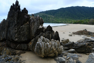 Beautiful Beach view with clouds, rocks and in the jungle 
