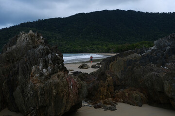 Beautiful Beach view with clouds, rocks and in the jungle 