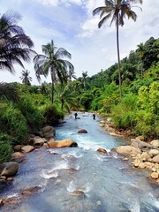 Panoramic landscape of bright blue river of dua rasa river and tropical rain forest