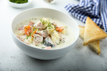 Traditional fish soup with vegetables and cream