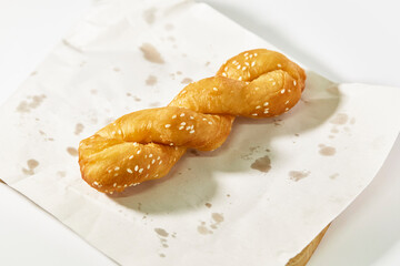 Spiral deep-fried dough stick (Patongo) with white sesame. The food that Asians like to eat a lot for breakfast. Popular street food.