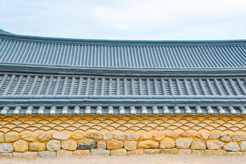 Solar panels on a gable roof. Beautiful, large modern house and solar energy. Rays of the sun.