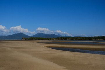 Beautiful Beach view with clouds, rocks and in the jungle 