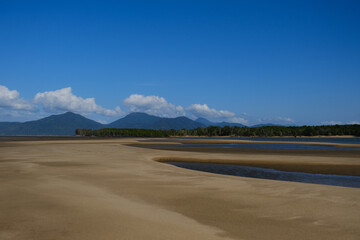 Beautiful Beach view with clouds, rocks and in the jungle 