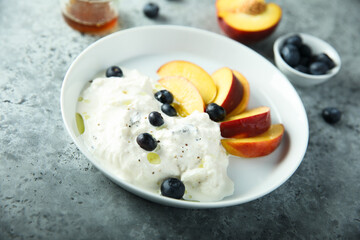 Fresh cheese with peach and blueberry