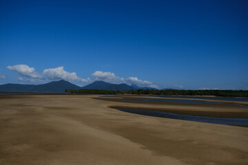 Beautiful Beach view with clouds, rocks and in the jungle 