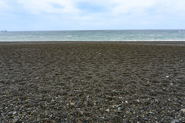 Fototapeta na wymiar 砂礫の海岸の風景素材