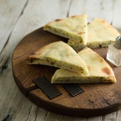 Homemade pie with cheese and herbs