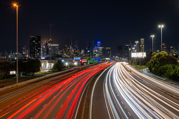 Fototapeta na wymiar A light trail on the Westgate Freeway in front of the Melbourne CBD
