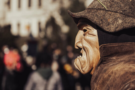 Monster wooden face mask. Horrific presence. Italian carnival parade.
