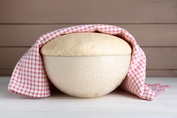 Rollo Brot Bowl of fresh yeast dough on white wooden table  © New Africa