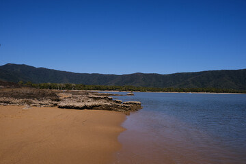 view over the ocean with Christal clear blue water on the background and a blue cloudless sky
