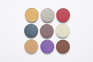 Beautiful eye shadow refill pans on white background, flat lay
