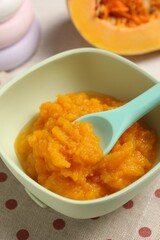 Baby food. Tasty pumpkin puree on table, closeup