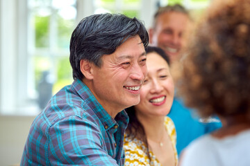 Fototapeta premium Group Of Multi-Cultural Senior Friends On Summer Vacation Meeting For Drinks In Holiday Apartment