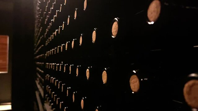 close-up shot of bottles stacked in a wine cellar. Bodegas Campo Viejo in La Rioja (Spain).