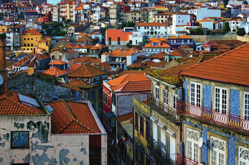Scenic landscape view of traditional ancient colorful buildings with red tile roofs in Ribeira district in Porto old town. Travel and tourism concept. UNESCO World Heritage Site