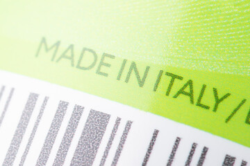 Made in Italy inscription on bottle of some cosmetics. Close up of inscription on product package, manufacturing cosmetics in Italy concept