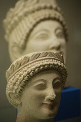 Archeology: Etruscan stone heads (The one in front, focusing, the one behind blurred)