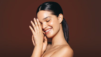 Woman with flawless skin radiating happiness and self-confidence