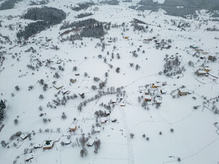 Winter Landscape with Small Village Houses Between Snow Covered Forest in Cold Mountains. Giresun - Turkey