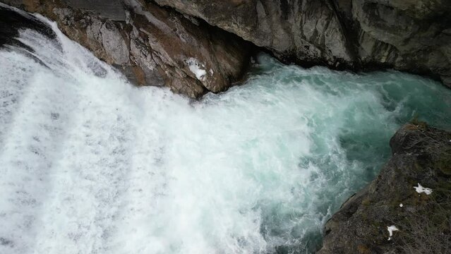 the lech fall near f&uuml;ssen in bavaria in the alps where a lot of water flows into the valley and the water flows back and forth between the rock walls recorded with a drone