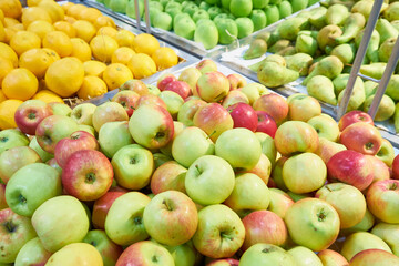 Ripe apples, lemons and pears close-up
