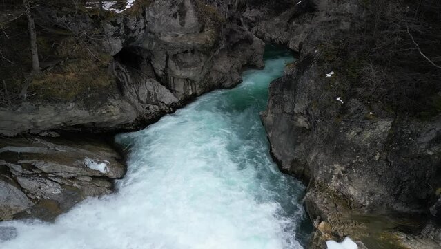 the lech fall near f&uuml;ssen in bavaria in the alps where a lot of water flows into the valley and the water flows back and forth between the rock walls recorded with a drone