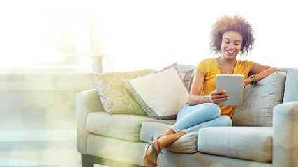 Black woman, tablet and sofa with mockup space with smile, blurred background and happy for meme on app. African gen z girl, home living room and mobile touchscreen in mock up for social network ux