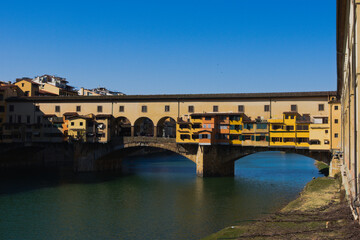 Fototapeta na wymiar Ponte Vecchio, the famous medieval bridge over the Arno River, in Florence, Italy