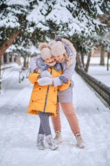 Mother and daughter enjoying beautiful winter day