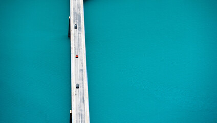 Scenic bridge over canyon lake Piva, Montenegro. Beautiful aerial drone view on river in national park in Europe