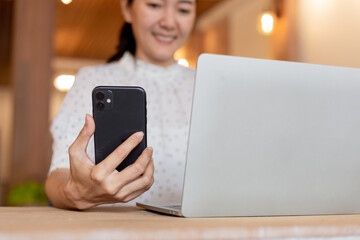 woman work using texting cell phone typing computer.student study education online learning.adult professional chatting on laptop,mobile contact us at Thinking business plan.connecting people concept