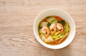 fried slice Chinese green cabbage and carrot with shrimp in soy sauce on bowl 