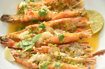 steamed river shrimp dressing spicy and sour lemon sauce on plate