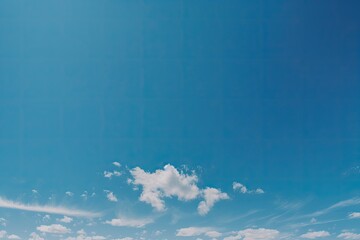 A stunning blue sky serves as the backdrop for fluffy white clouds, creating a serene image with ample copy space, perfect for adding text or graphics to convey any message. Generative AI