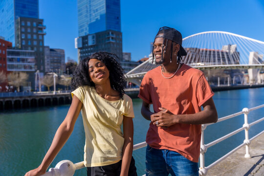 Young african american women in the city, lifestyle friends concept, vacation portrait smiling