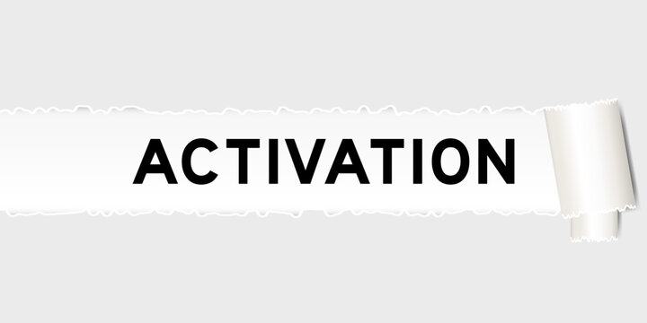 Ripped gray paper background that have word activation under torn part