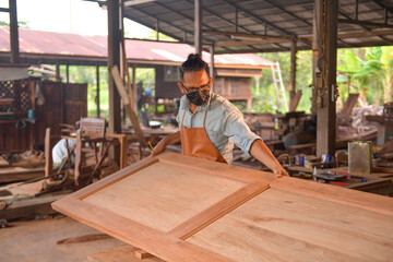 Portrait carpenter man  happy attractive hardworking