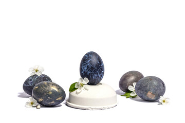 Easter egg on a beton stand isolated on white background. Traditional symbol, blooming cherry