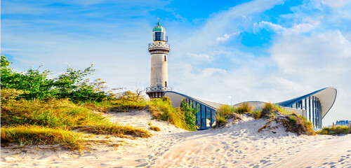 Banner with lighthouse in Warnemunde Rostock. Germany baltic sea vacation and travel destinations. Copy space for text - obrazy, fototapety, plakaty