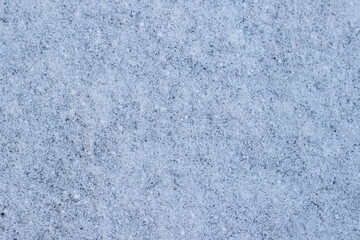Fototapeta na wymiar Frosty texture of snow, background from snow close-up. Place for text