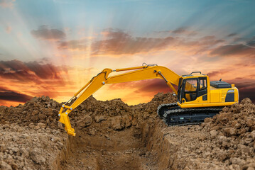 Crawler Excavator is digging soil in the construction site on a sunbeam background.