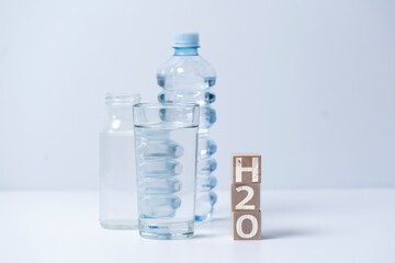 fresh pure drinking water, wooden cubes with h2o text