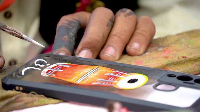 Slow motion shot of traditional Pakistani Painting artists working on their crafts