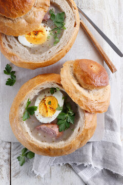 Zurek - sour soup with egg and sausage in bread (Easter dish in Poland)