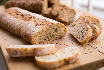 fresh loaf of bread on wooden board